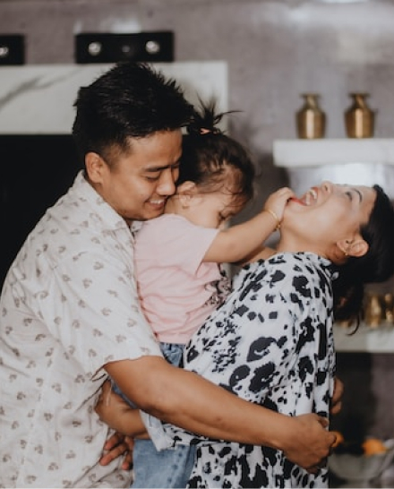 family smiling and hugging